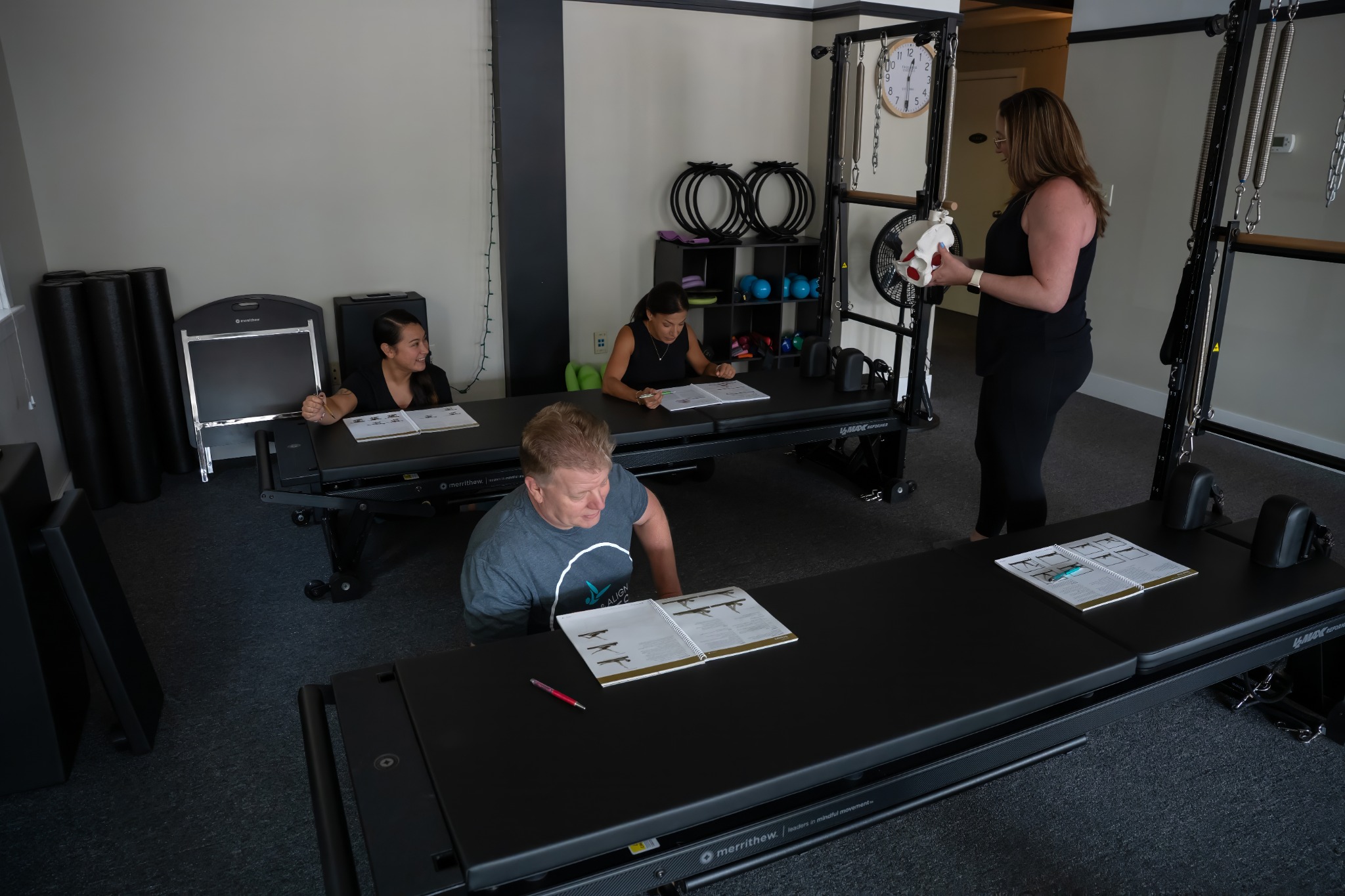 Alicia teaching movement anatomy in the Revive & Align studio