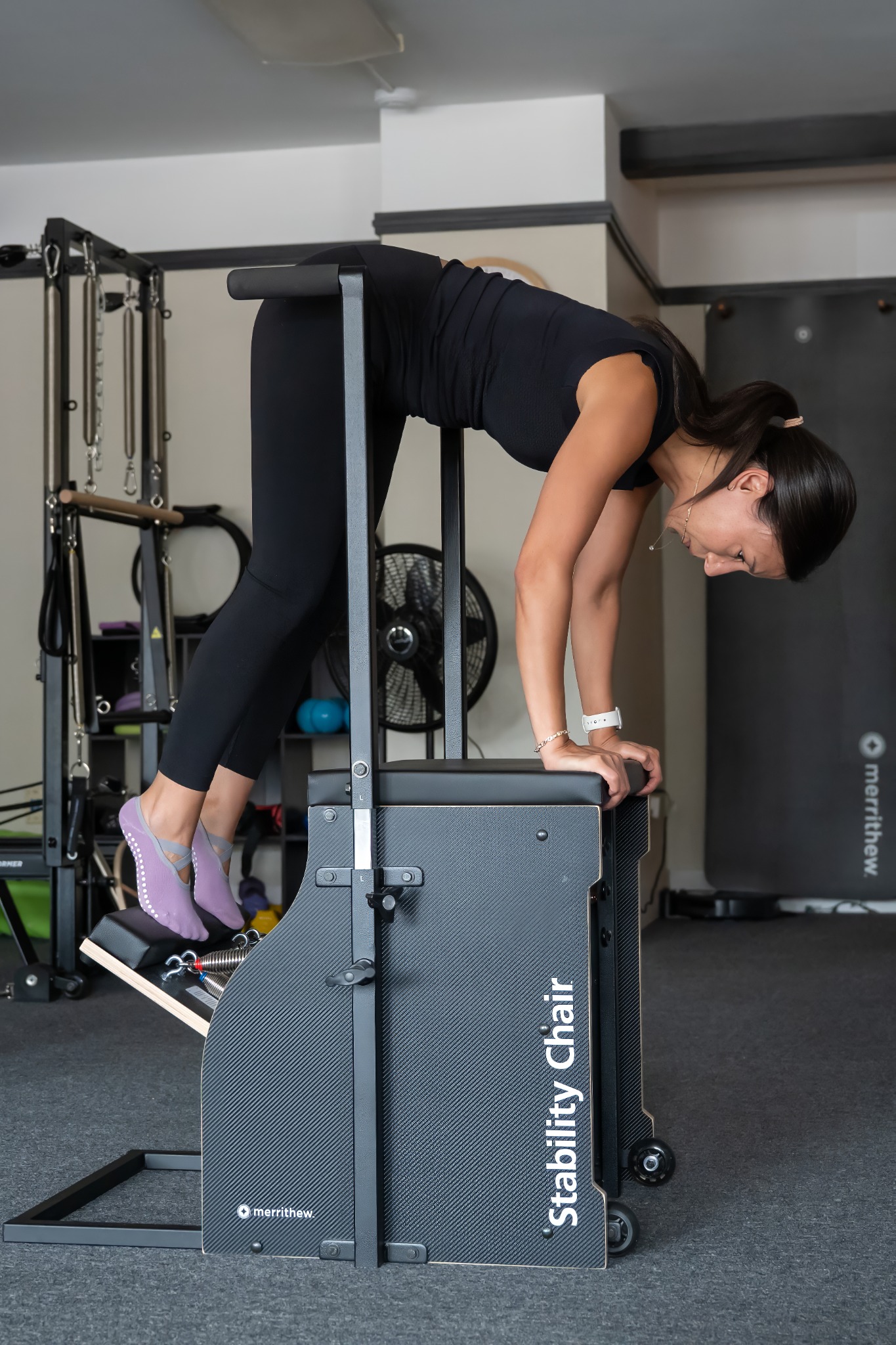 Client practicing Pilates on the Stability Chair