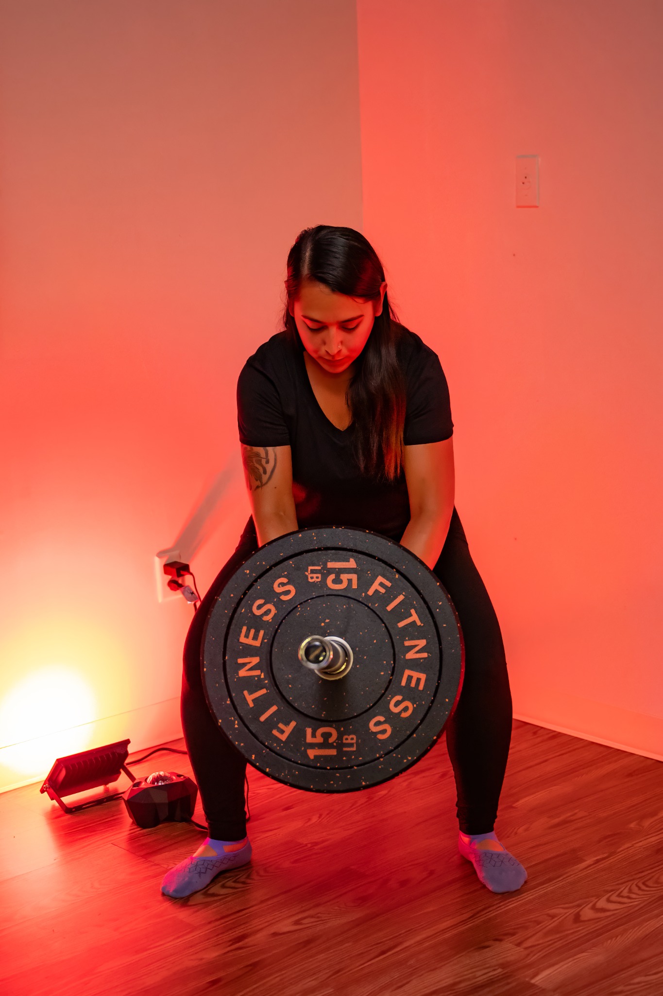 Client training with weight plates at Revive Strong